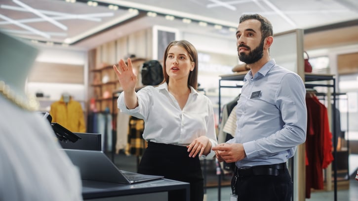 Team of retail employees working during mid shift hours in a store