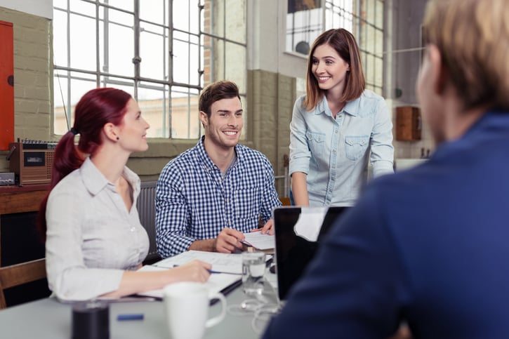 HR manager discussing travel expenses UK policy with an employee in the office